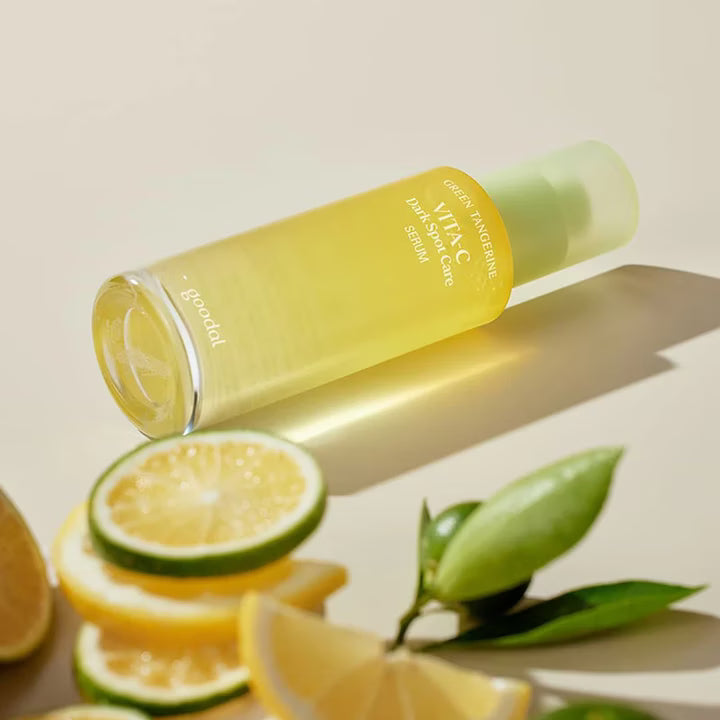 Goodal Green Tangerine Serum surrounded by fresh citrus – antioxidant-rich formula to fade dark spots and boost glow