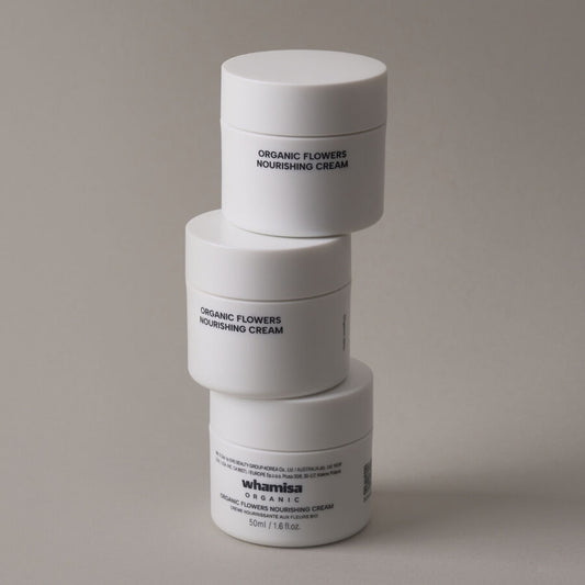 Stack of Whamisa Organic Flowers Nourishing Cream jars – minimalist Korean skincare packaging with natural ingredients