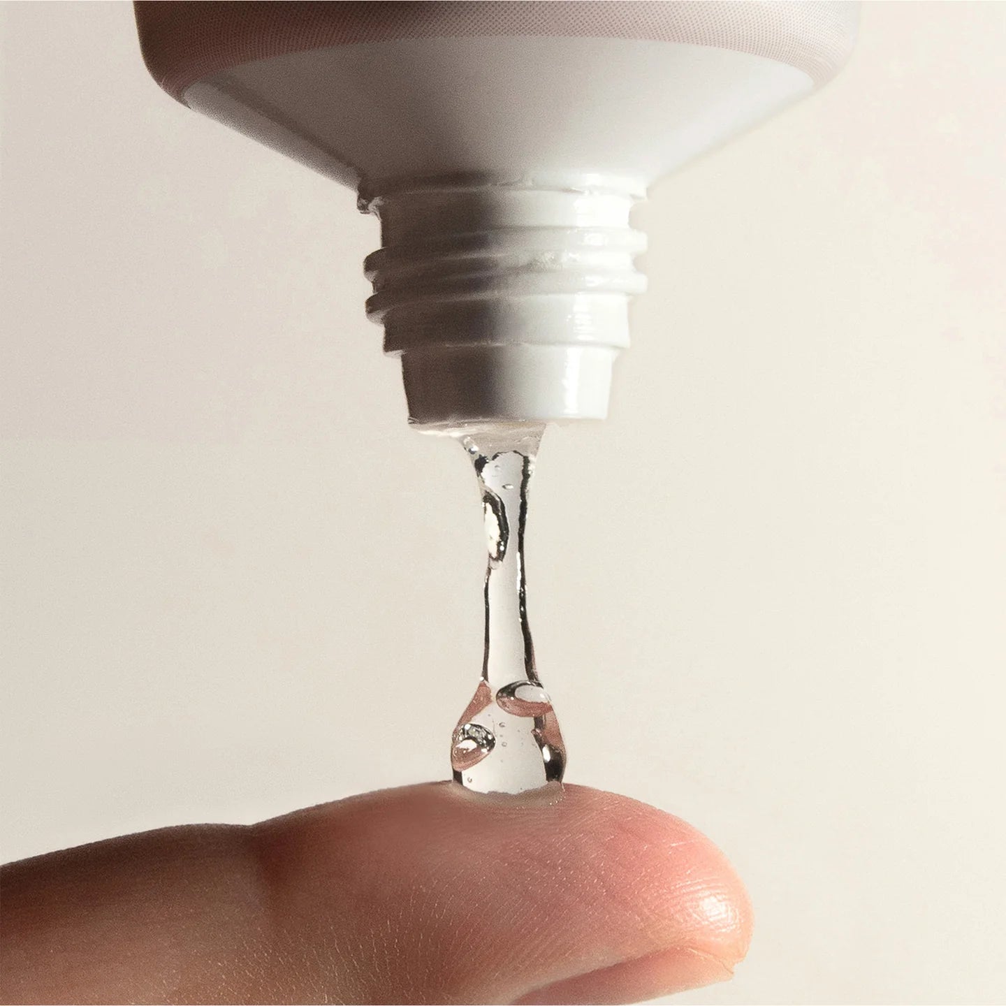 Haruharu Wonder cleansing gel texture – clear gel dripping onto fingertip