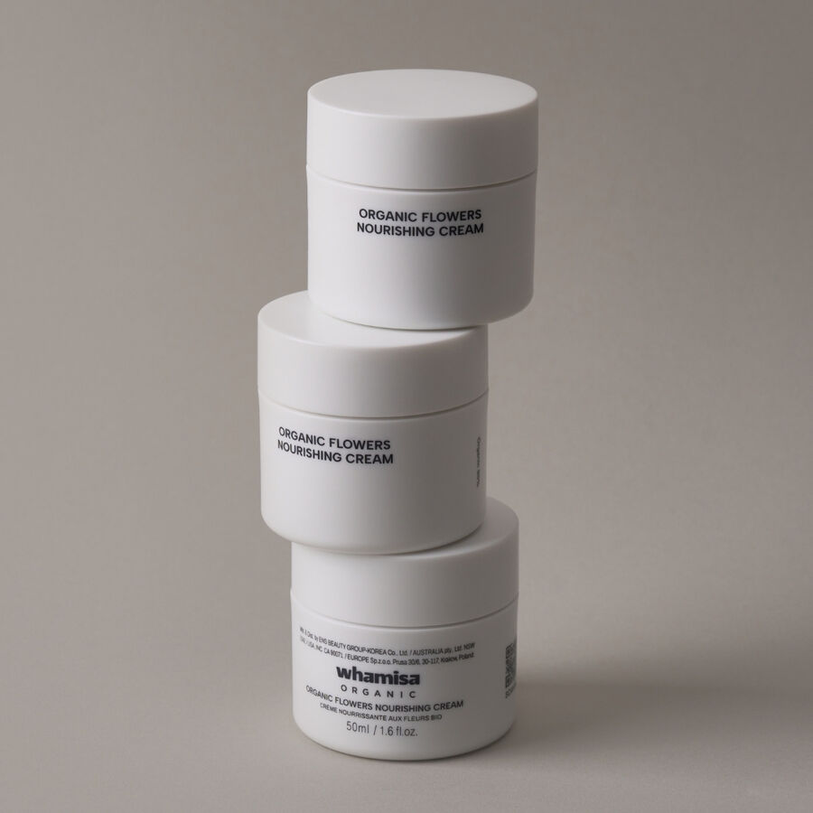 Stack of Whamisa Organic Flowers Nourishing Cream jars – minimalist Korean skincare packaging with natural ingredients